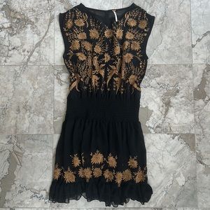 Free People sheer little black dress with semi open back